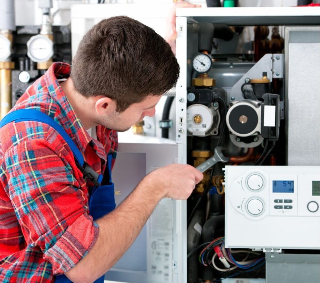 Tech working on HVAC systems