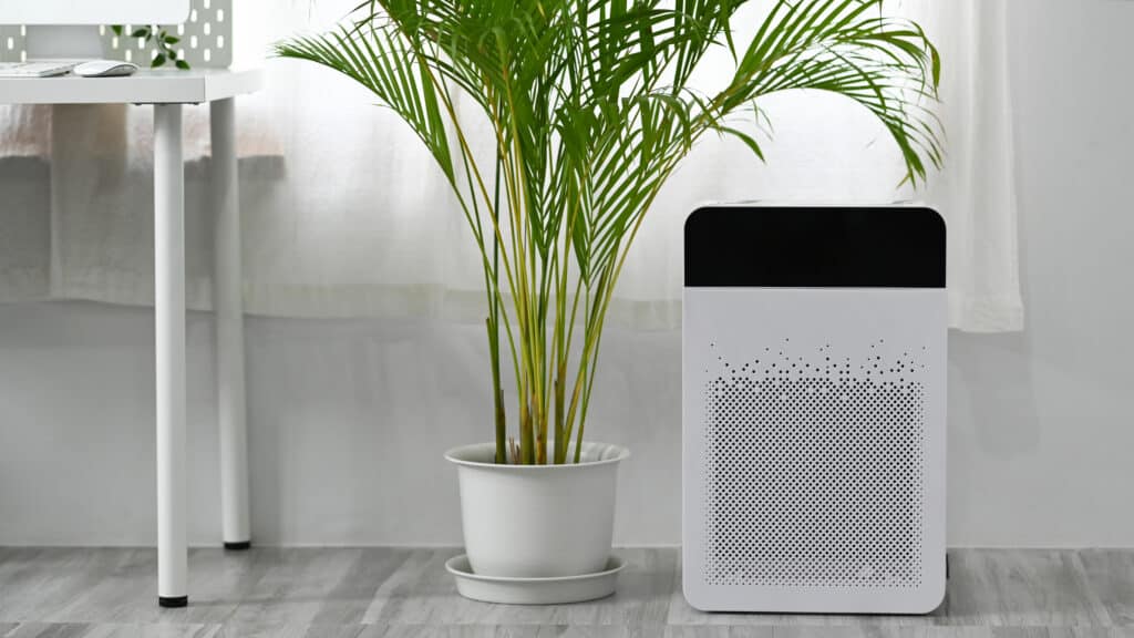 Modern air purifier on n floor in bright living room for filter