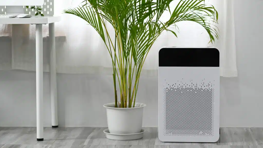 Modern air purifier on n floor in bright living room for filter